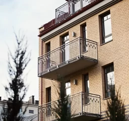apartment building with wooden windows